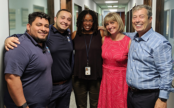 Marine Corps Veteran and Intake Supervisor Dr. Juan Flores, far left, at Operation Sacred Trust with Engagement Director Jacob Torner, VA VISN 8 Network Homeless Coordinator Nikki Barfield, VA SSVF Regional Coordinator Jennifer Colbert, and program co-founder Seth Eisenberg. The group provided more than $4.2 million in emergency funding for very low income Veterans facing homelessness in Miami-Dade and Broward counties.
